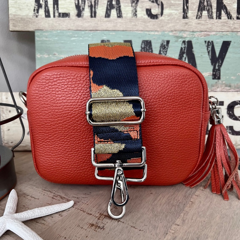Orange camera style bag with a wide woven strap combo